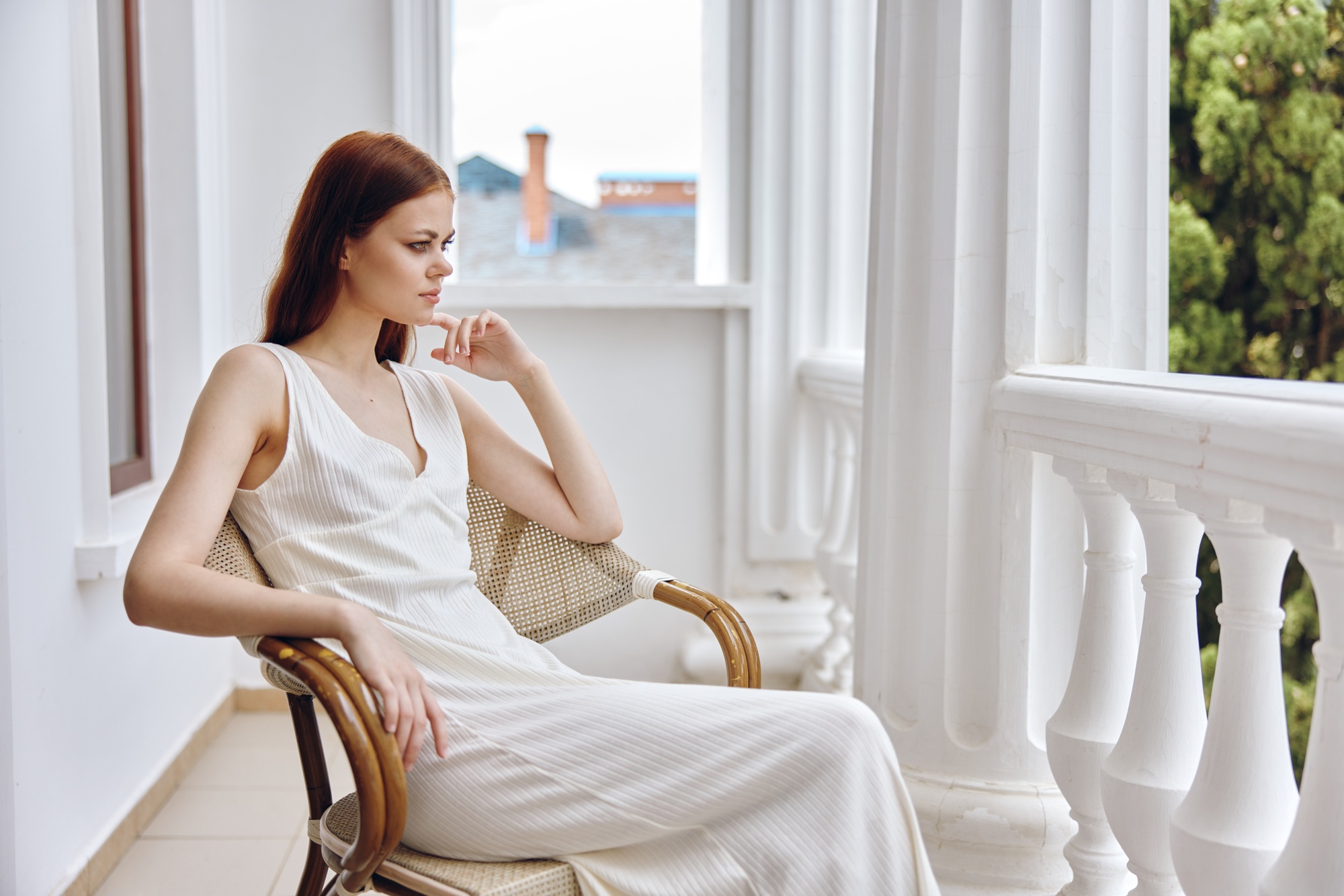 woman sitting on the balcony vacation lifestyle luxury